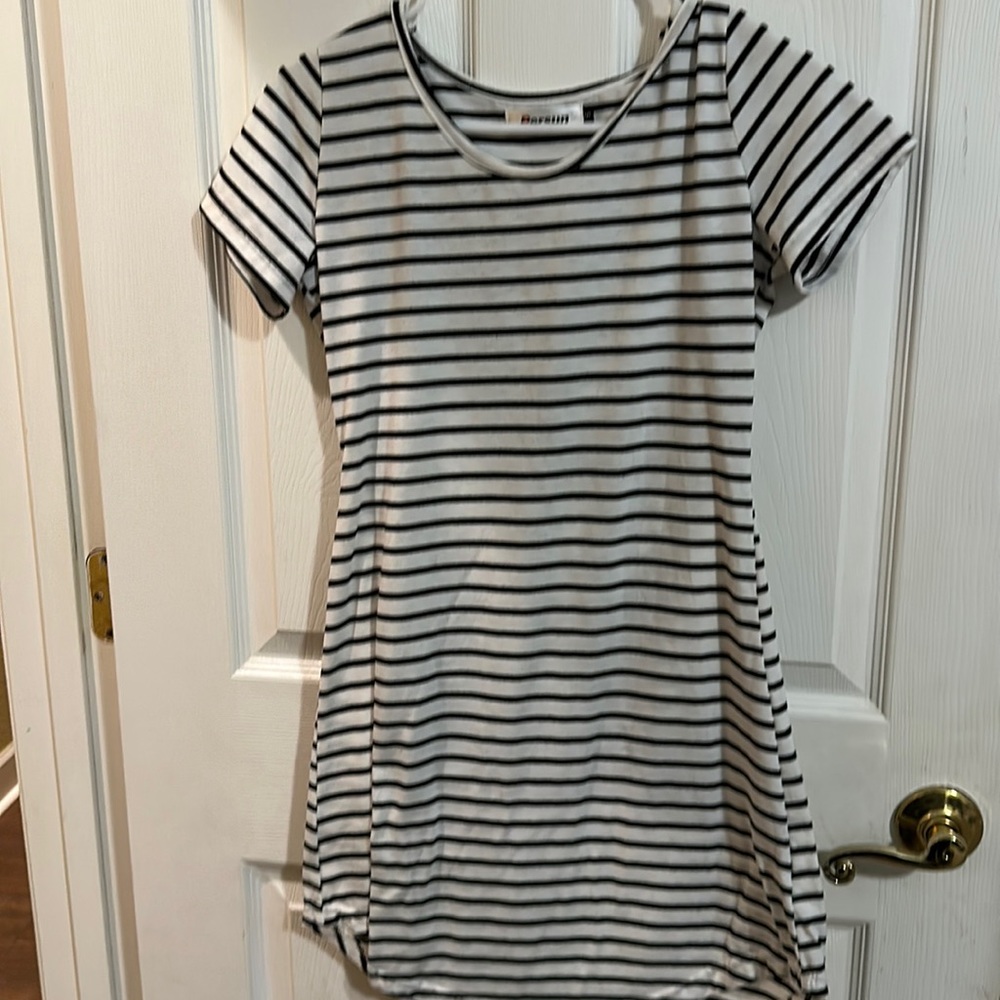 Black and white strip dress by Persun. Girls Size small.
